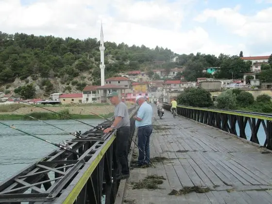 Fishermen on a bridge on river buna (bojana) near shkoder