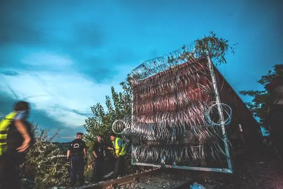 Railway wagon with barbed wire at Hungary-Serbia border barrier